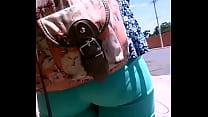 Ass in the street with tight green pants