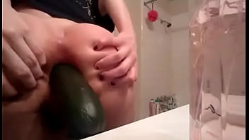 Young blonde gf fists herself and puts a cucumber in ass