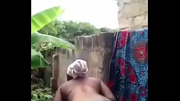 african woman washes in front of her cam