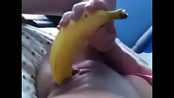 She masturbates with a banana.MP4