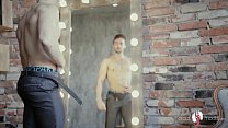 Hot sexy bearded guy undresses at the mirror showing his young uncut cock