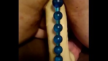 Dildo ride with anal beads