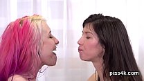 Sensual lesbian chicks get splashed with pee and squirt wet twats