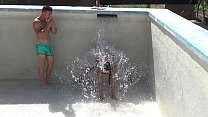Two step brothers play naked with the water that fills their pool in Valencia