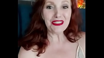 Redhead Nymph shows her boobs