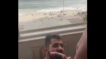 Suckling this 27 cm dick with pleasure with this beautiful view of the beach (Complete in RED)