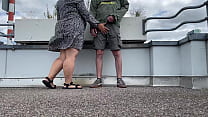 Spanking a sexy MILF's gorgeous fat ass while she jerks off my cock on the top of the parking lot