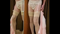 Crossdresser wearing luxurious lingerie in her boudoir