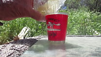 Pouring a water glass of pre-cum and cum mixed together and filling a shotglass